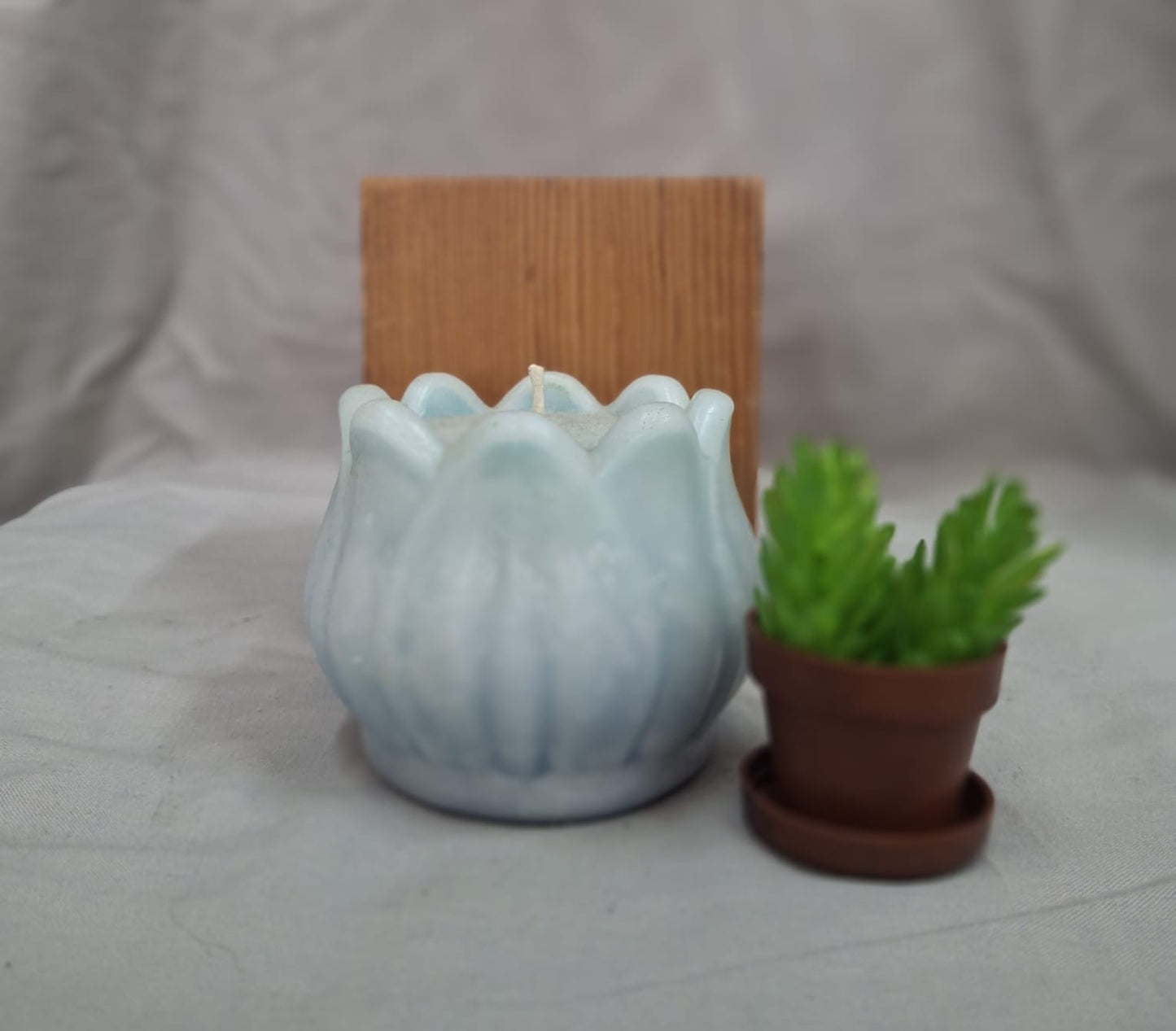 Lotus-shaped candle symbolizing purity and enlightenment, handcrafted for meditation, rituals, and spiritual décor