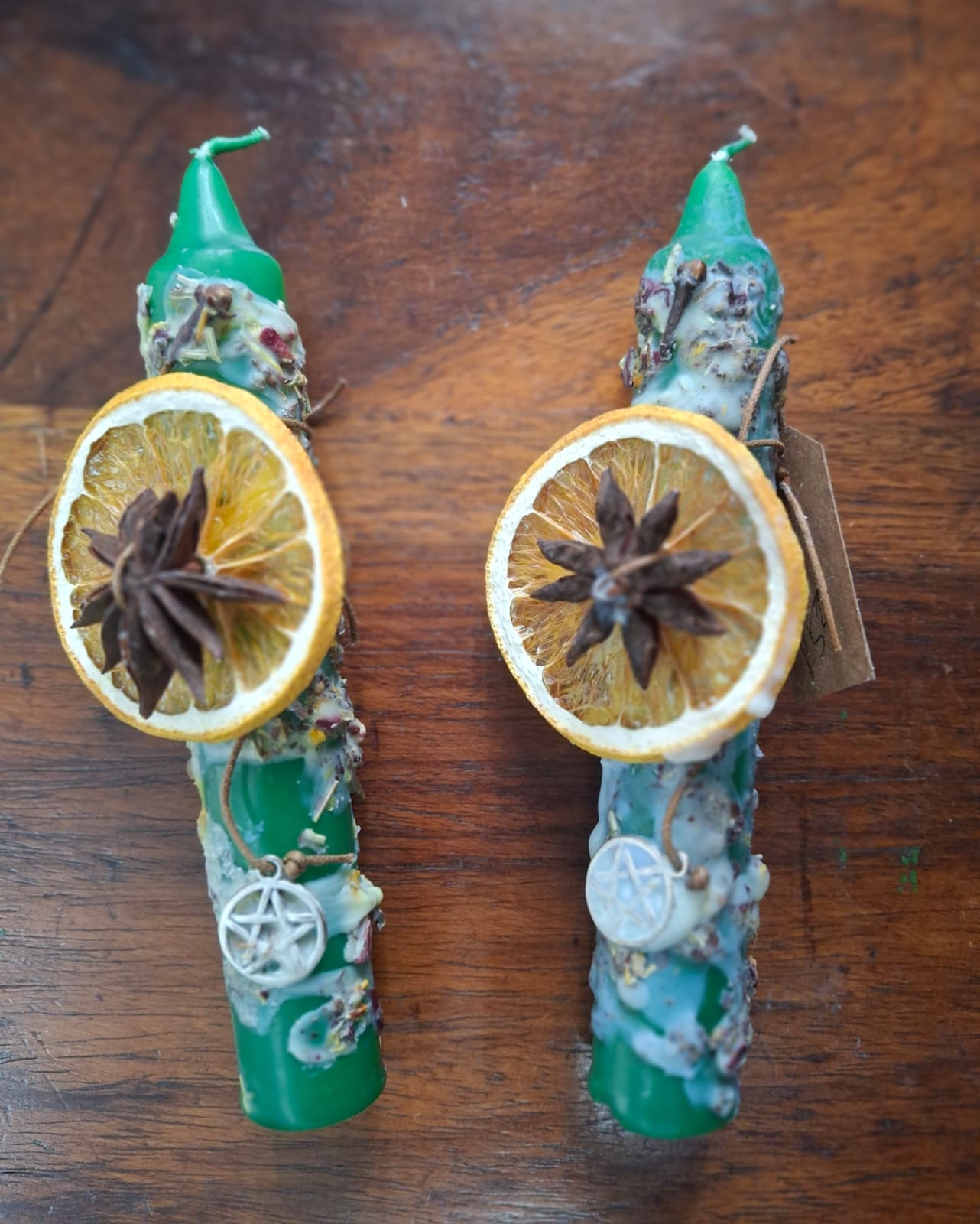 Green dressed candle with dried lemon and clove – for abundance, balance, and spiritual growth.